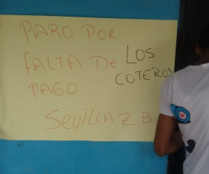 Con esta pancarta, los coteros se tomaron la bodega del PAE en Sevilla, Zona Bananera.