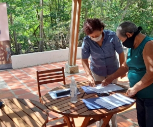 Firma de acuerdos de las familias de la Asociación Unidos por la Recuperación de Puerto Caimán.